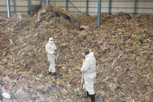 Workers at a waste disposal site